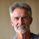 Headshot of David, a male yoga instructor with a gentle, reassuring expression.